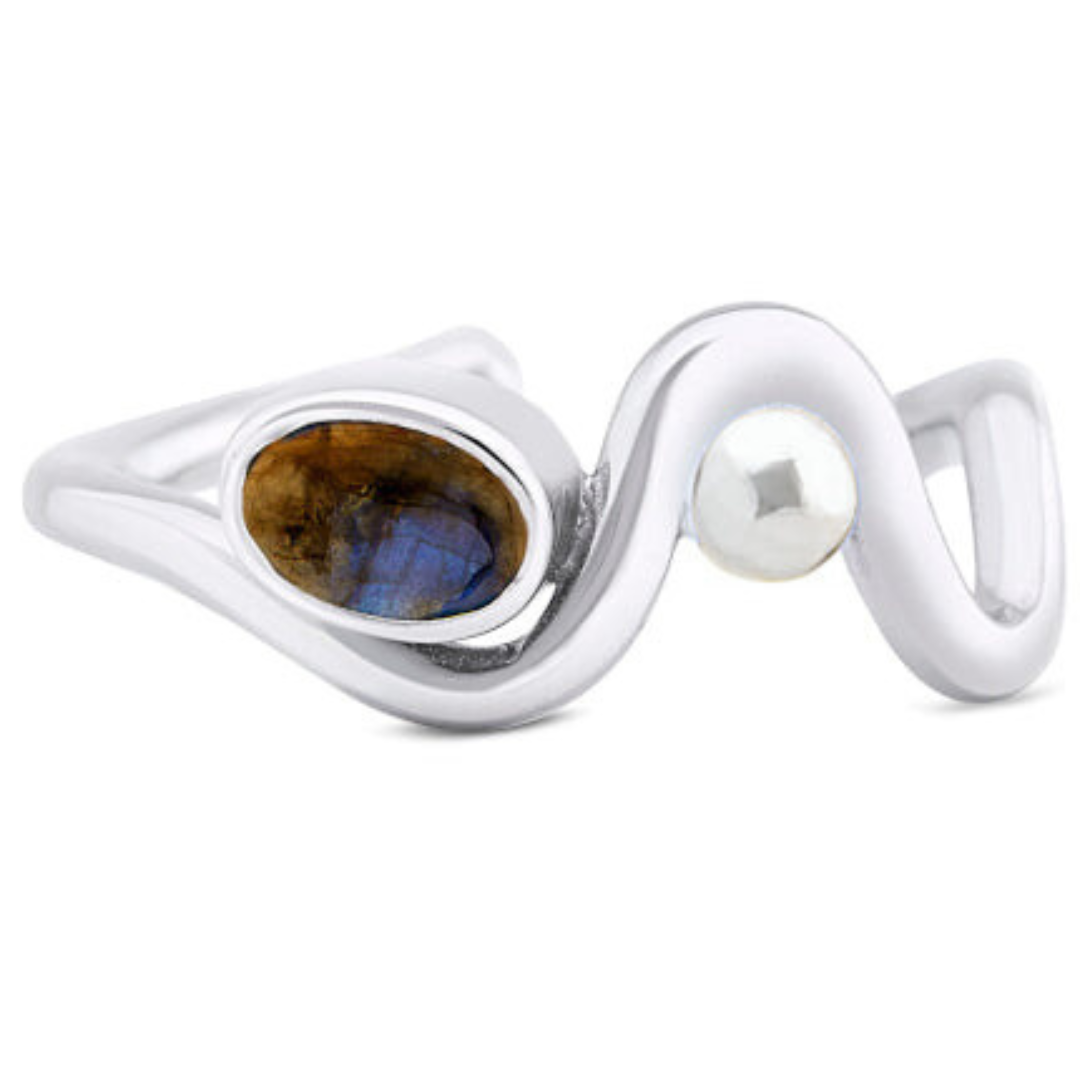 Gallardo & Blaine Designs' Adjustable Heartbeat Ring features a wavy sterling silver band with an oval labradorite that has an enchanting blue-brown sheen and a round pearl accent, subtly enhancing the allure of colored gemstones.