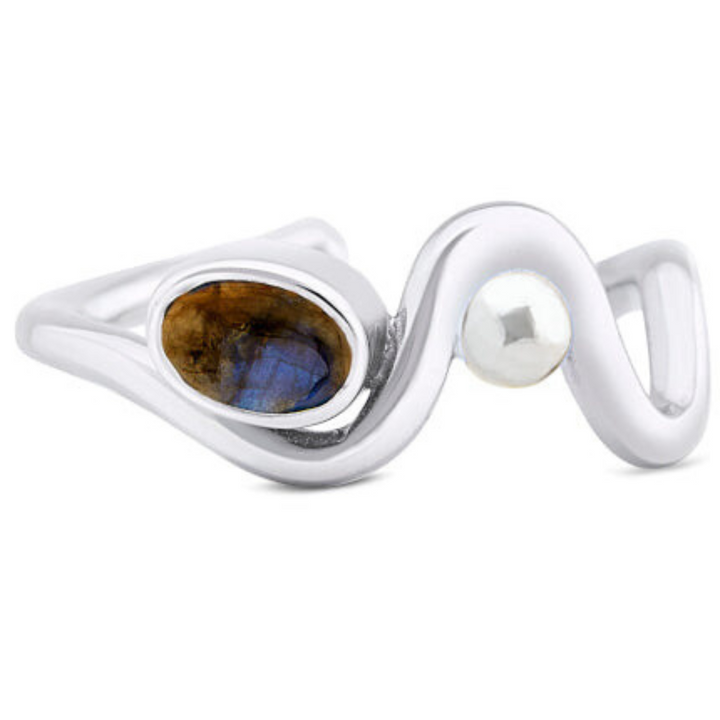 Gallardo & Blaine Designs' Adjustable Heartbeat Ring features a wavy sterling silver band with an oval labradorite that has an enchanting blue-brown sheen and a round pearl accent, subtly enhancing the allure of colored gemstones.