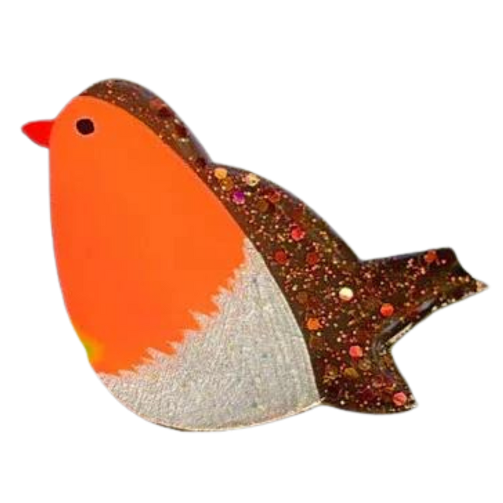 The Naoi Robin Pin Brooch is a handpainted wooden accessory featuring an orange body, white belly, black eye, red beak, brown wing and tail with colorful glitter accents, finished in smooth resin.