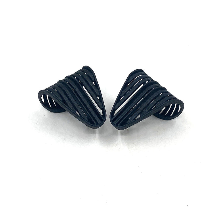 A pair of Vibe Grill Earrings made from intricately layered strips of SLS Nylon material, designed to create a basket-like structure. The earrings are displayed on a white background.