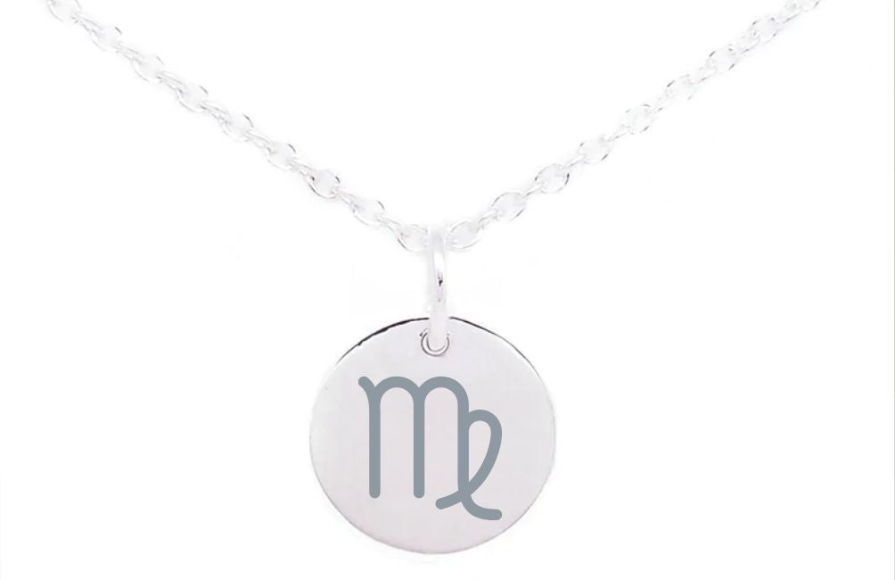 A Horoscope Large Disc Charm Silver featuring a round pendant with the Virgo zodiac sign engraved on it. The pendant, resembling intricate sterling silver charms, hangs from a delicate chain set against a plain white background by Personalised Charms.