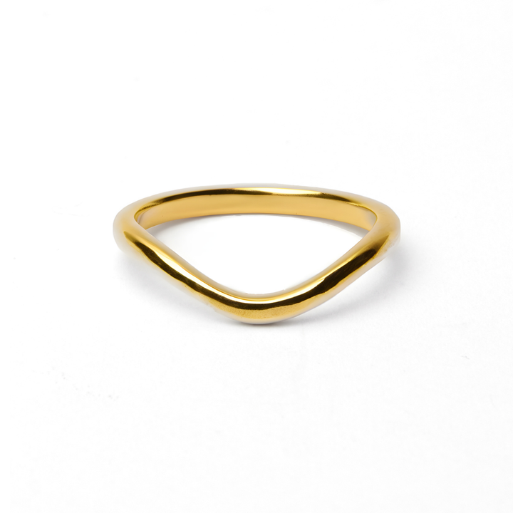 The Collective Dublin's Dainty Curved Wedding Ring features a sleek 2mm band with a subtle V-shape, elegantly displayed on a plain white background.