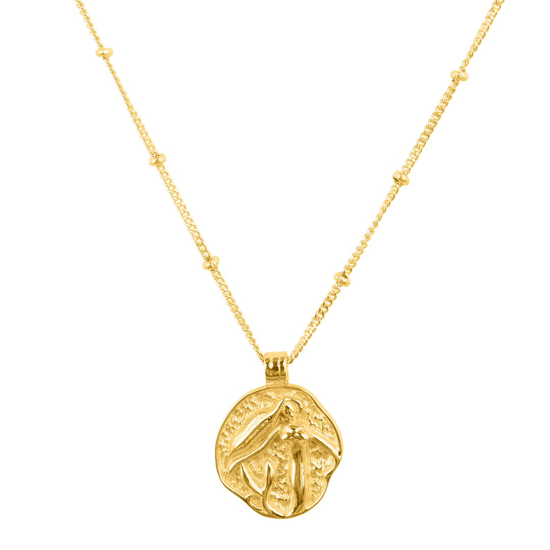 Gold plated, coin pendant necklace. Pendant has a mermaid slightly raised to define her outline.