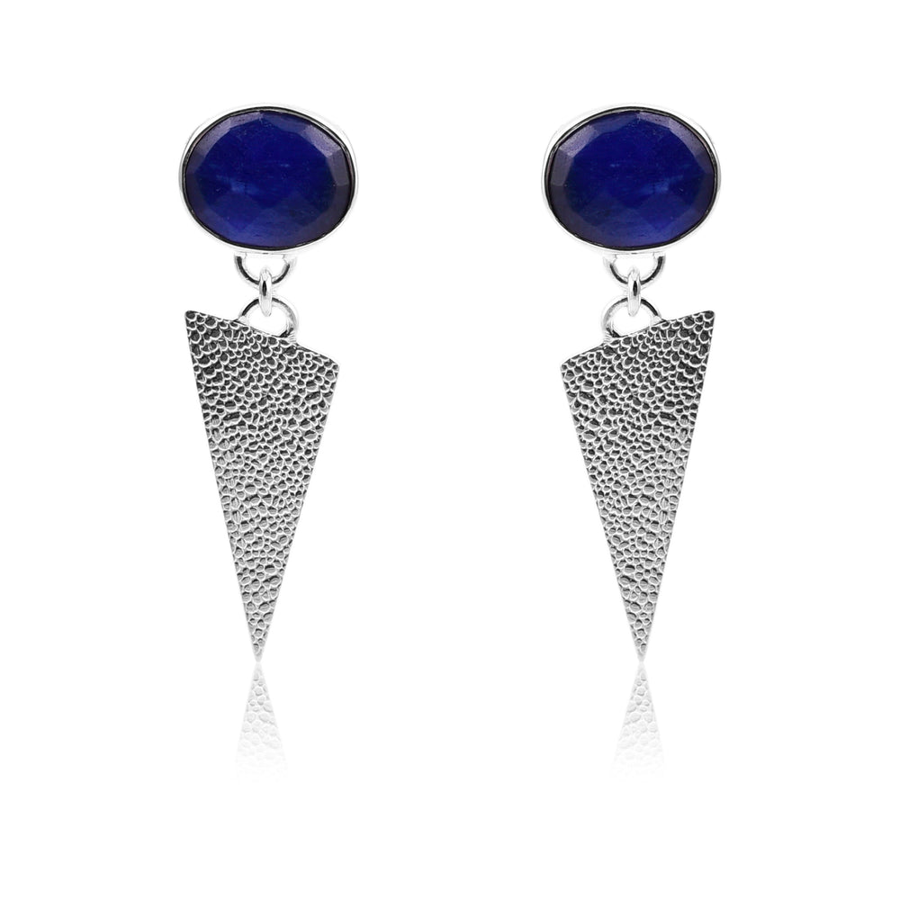 The Sapphire Silver Triangle Earrings from Watermelon tropical feature round, blue labradorite gemstones at the top attached to textured, cone-shaped sterling silver dangles. The handmade jewellery boasts a modern, geometric design and is displayed against a plain white background.