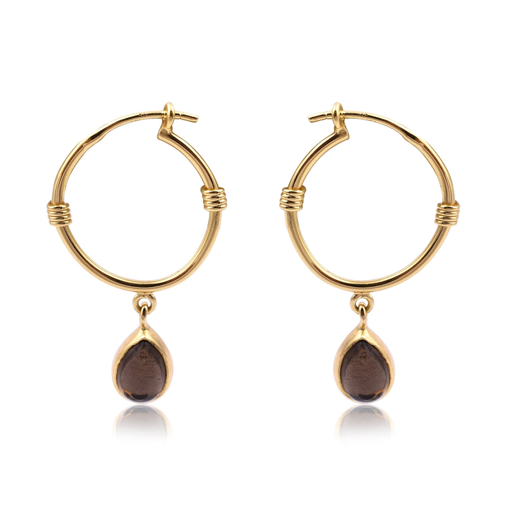 A pair of Watermelon tropical Smoky Gold Dangle Hoops featuring a small gold and brown teardrop-shaped pendant hanging from each hoop. The hoops have a clasp closure and a simple, elegant design with minimal detailing. These handmade jewellery pieces are elevated by the addition of sophisticated teardrop pendants.