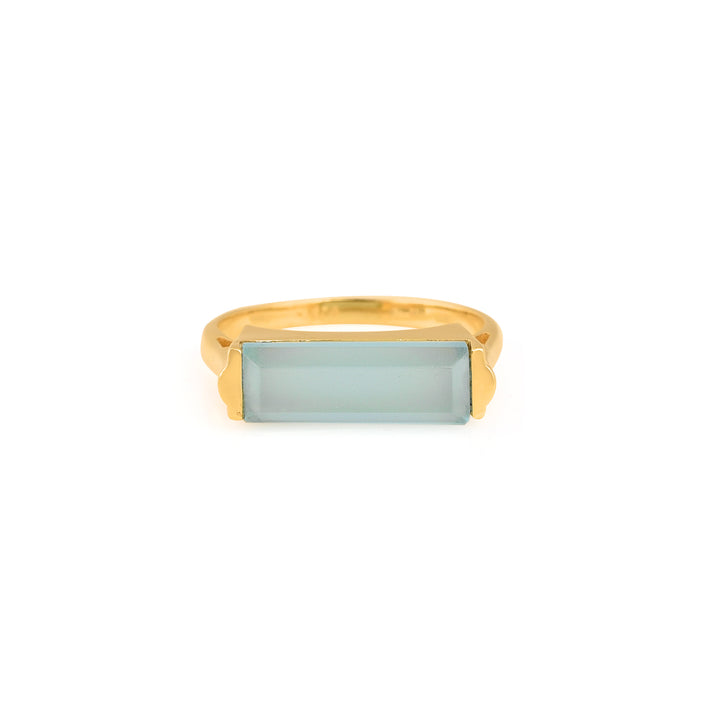 Gold plated ring with long, rectangular pale blue stone.