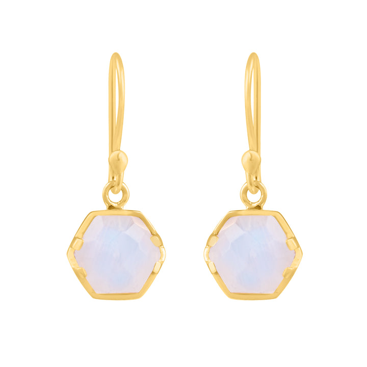 A pair of Piper Hexagonal Moonstone Drop Earrings from Watermelon Tropical features translucent, faceted Rainbow Moonstone set in yellow-gold frames. The earrings dangle from simple, elegant hooks.