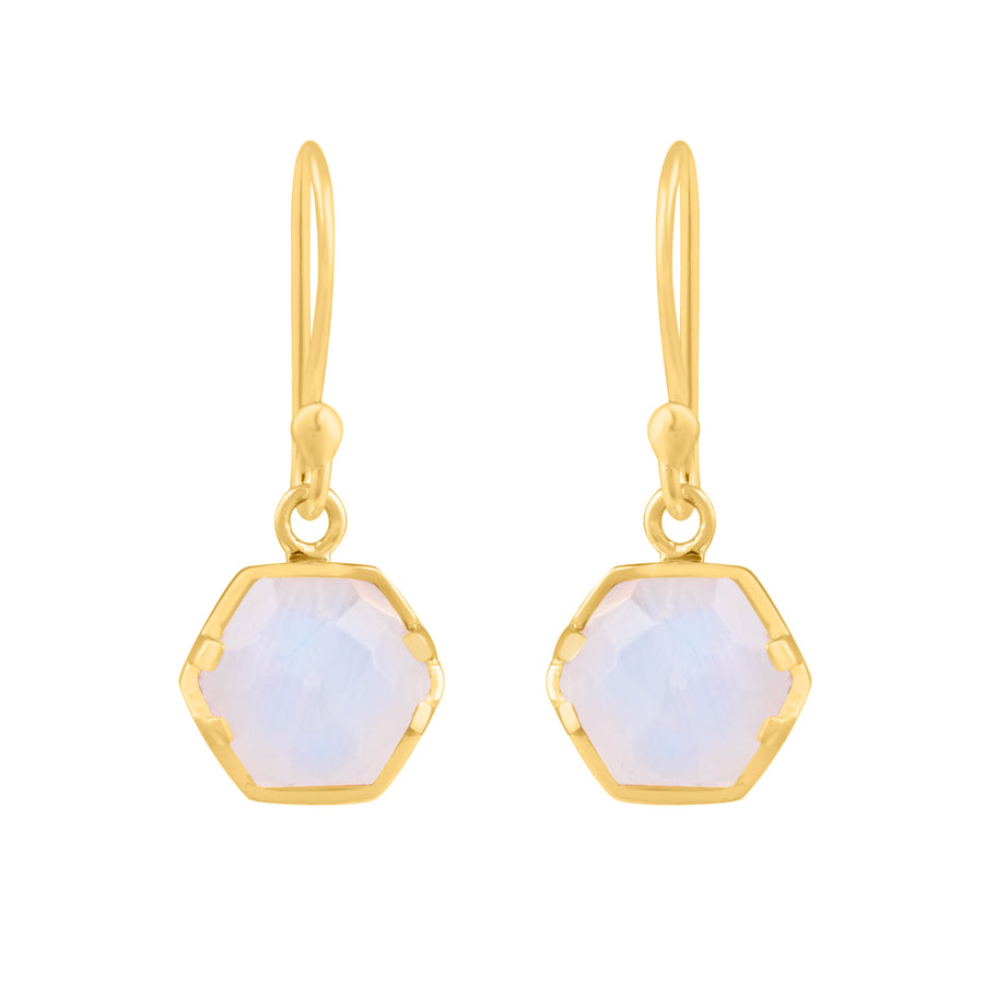 A pair of Piper Hexagonal Moonstone Drop Earrings from Watermelon Tropical features translucent, faceted Rainbow Moonstone set in yellow-gold frames. The earrings dangle from simple, elegant hooks.