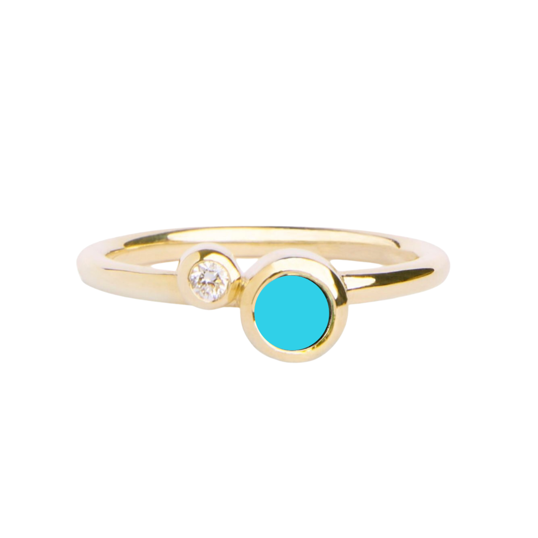 The Willow Shimmer 9ct yellow gold ring by Madeleine Fine Jewellery showcases a small round white diamond and a larger blue topaz both bezel set on a delicate band.
