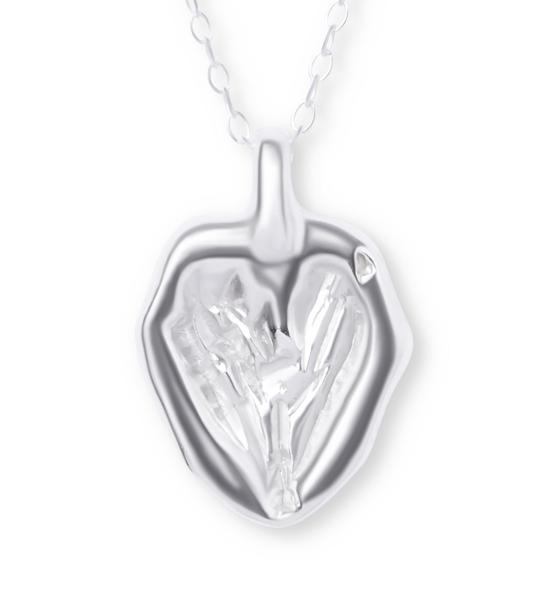 The You Melt My Heart Silver Pendant by Ava Jane Jewellery features a handmade, heart-shaped sterling silver design with organic textures and a shiny finish, suspended from a delicate chain for an artistic, modern touch.