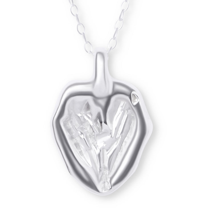 The You Melt My Heart Silver Pendant by Ava Jane Jewellery features a handmade, heart-shaped sterling silver design with organic textures and a shiny finish, suspended from a delicate chain for an artistic, modern touch.