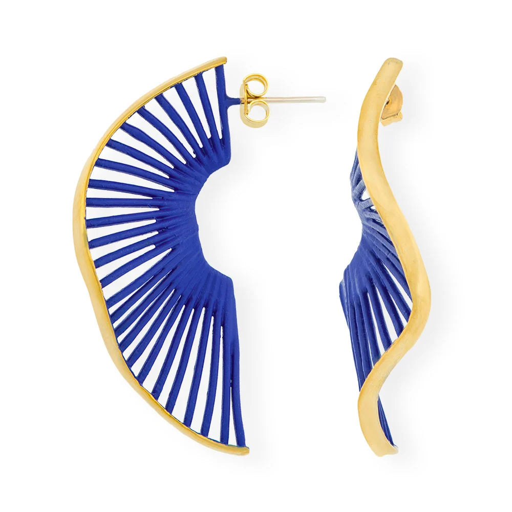 A pair of gold and blue statement earrings on a plain white background. One earring is shown from the front, displaying a gold-plated frame with blue cord wrapped in a radial fan pattern, and the other is shown from the side, displaying the wavy gold-plated profile and the blue cord wrapping.