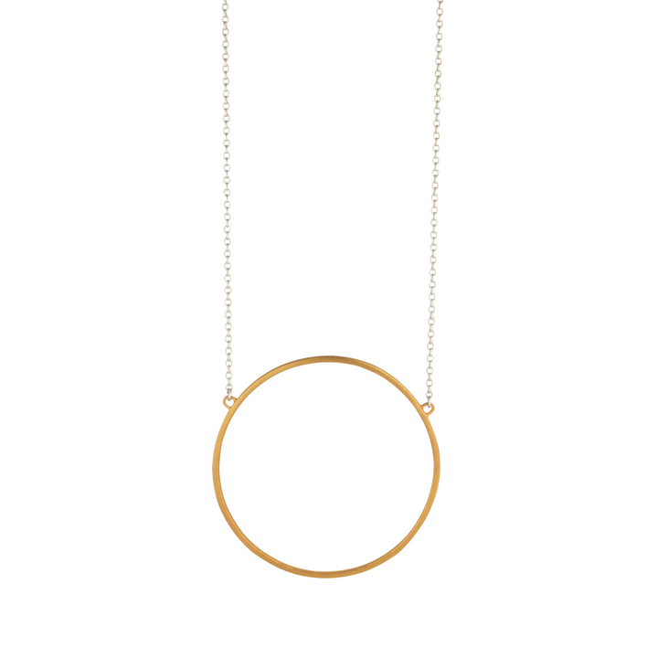 A necklace featuring a delicate gold chain and a simple yellow gold vermeil circle pendant. The design is minimalistic and elegant, with the circular pendant hanging at the center of the chain. This is known as the Ancaire Yellow Gold Vermeil Neckpiece by Lynsey de Burca.