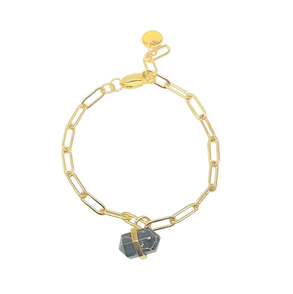 The Aria V Ayin Bracelet features elongated gold chain links and a dark gemstone pendant secured by a gold band, shown on a white background.