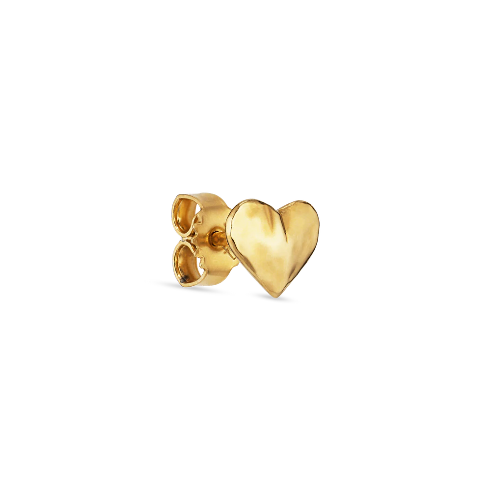 The Bruised Heart Stud by Jane Koenig is a small gold-plated heart ear stud with a matching butterfly back, shown against a plain white background.