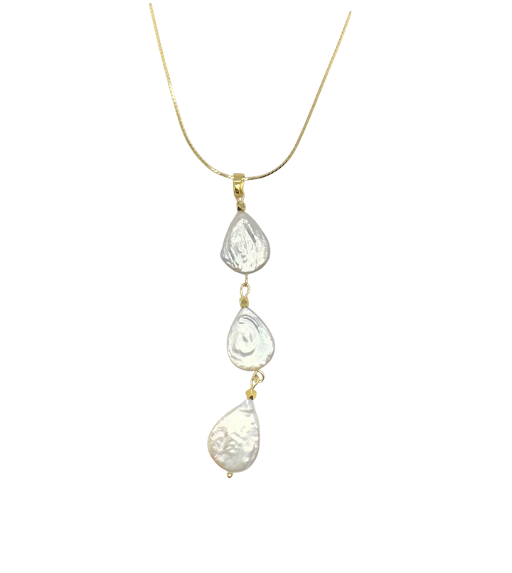 Necklace with three teardrop-shaped pearls on a gold chain against a white background