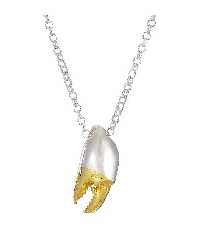 A **Jennifer Kinnear Crab Claw Necklace Large** features a silver chain with a pendant shaped like a crab claw. The two-tone design showcases the upper half in silver and the lower half with a Silver w/Gold Plated Tip. The detailed claw pendant dangles elegantly from the chain.