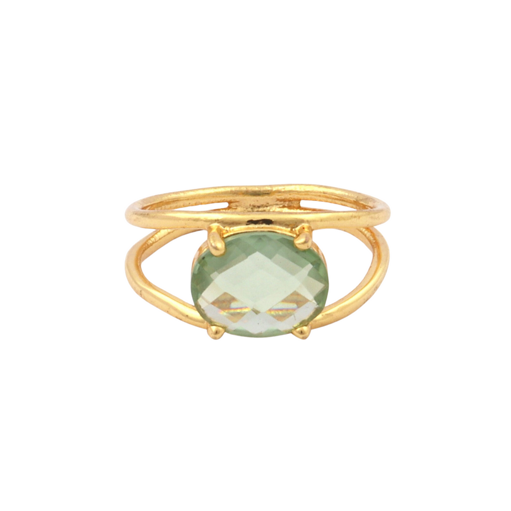 The Charlotte Gold Ring by Watermelon tropical features a gold-plated sterling silver double band and an oval, faceted green amethyst centerpiece.