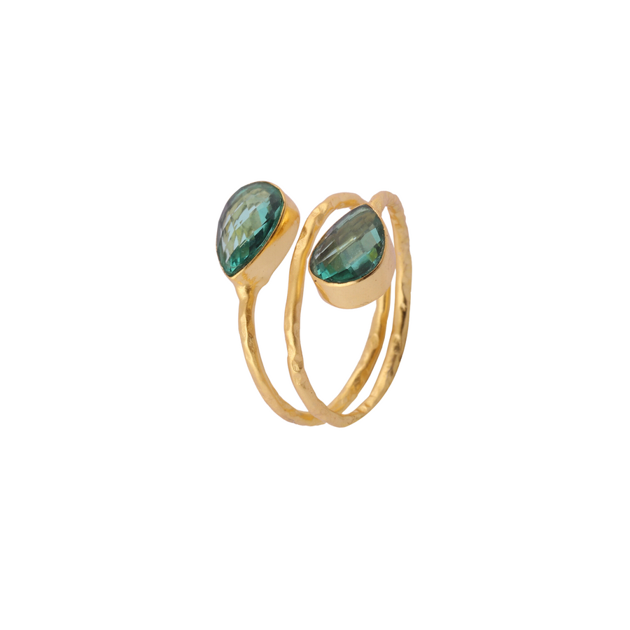 A Cleo Gold Ring by Watermelon Tropical, adjustable wrap-around snake ring featuring two green, teardrop-shaped gemstones with a faceted surface. The ring has a hammered texture, giving it a unique, handcrafted look. Set against a white background.