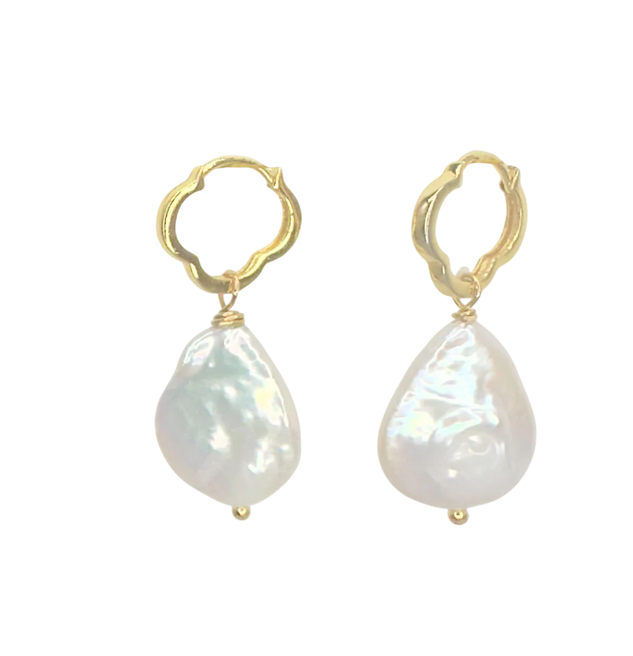 The Clover Pearl Earrings by Aria V feature gold hoops adorned with irregularly shaped freshwater pearls, showcased on a plain white background.