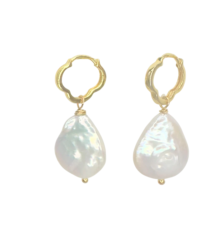 The Clover Pearl Earrings by Aria V feature gold hoops adorned with irregularly shaped freshwater pearls, showcased on a plain white background.