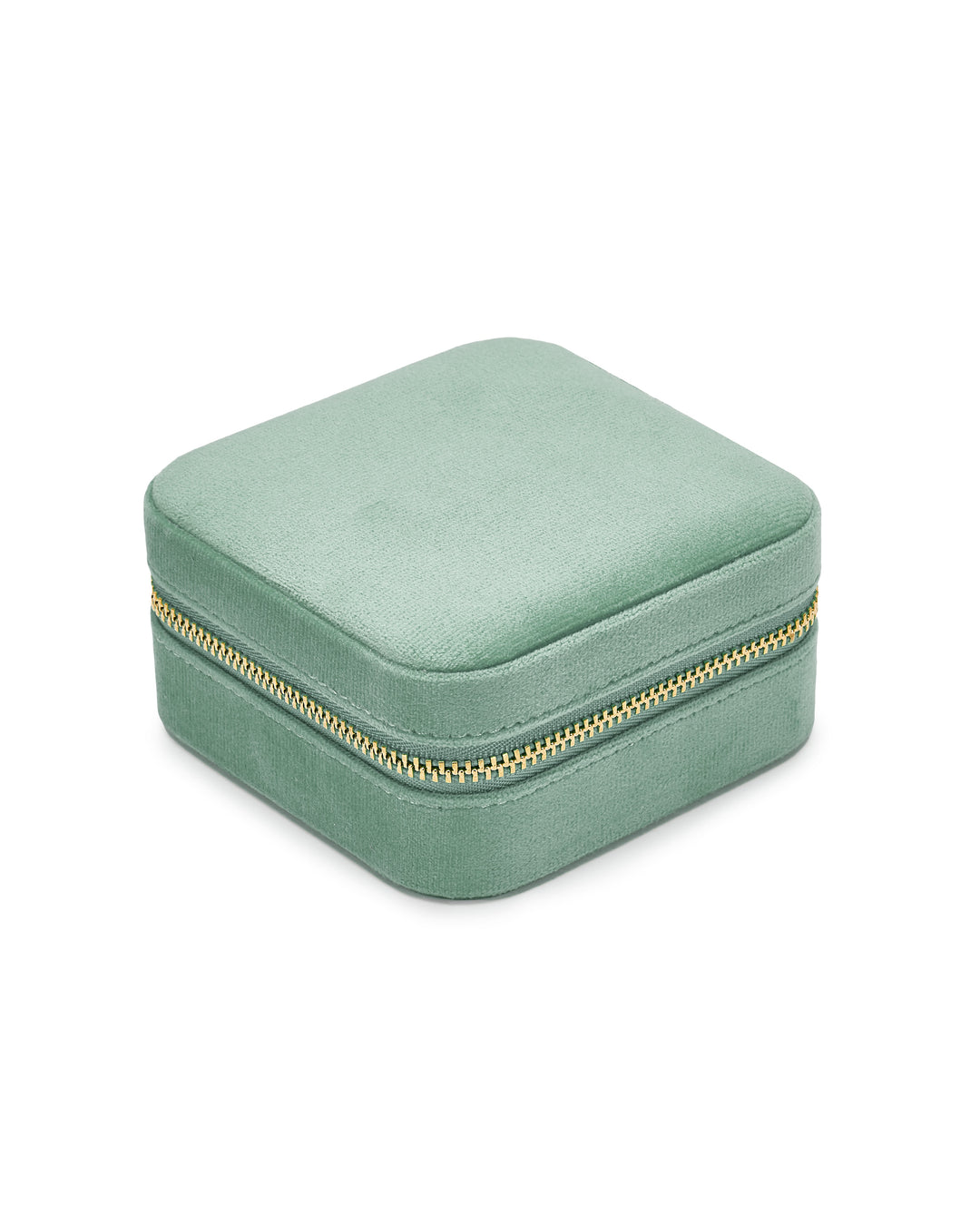 A small, square, light green jewelry box with a soft, velvet-covered exterior and a gold zipper around the middle. Travel-friendly and stylish, the SoCases Luxurious French Green Velvet Travel Jewellery Box is closed and appears plush and elegant.