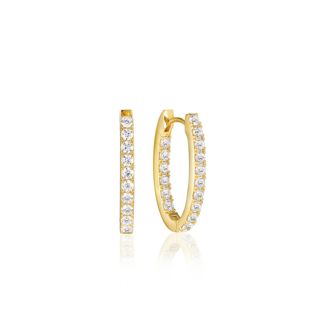 The Sif Jacobs Ellisse Piccolo Oval Hoop Earrings are small gold-plated hoops adorned with a row of sparkling white diamonds, displayed from front and side angles on a white background.
