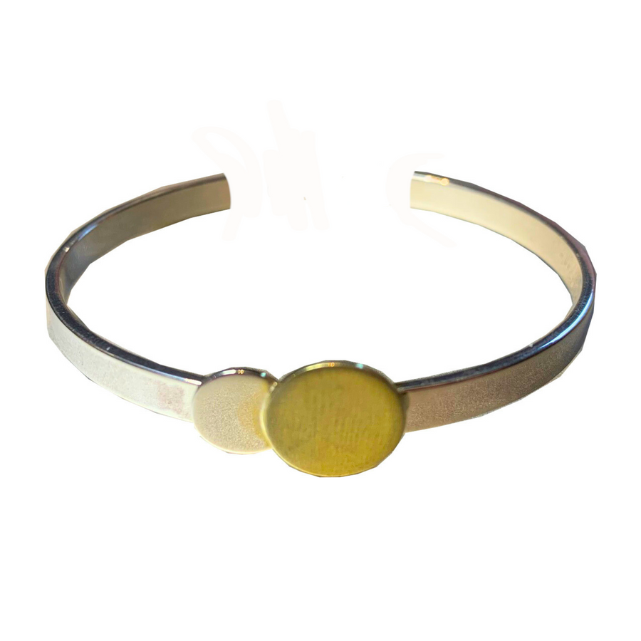 A gold vermeil bracelet featuring two round yellow enamel accents positioned at the center. The Archeol Cuff in Sterling Silver & Gold Vermeil is simple and elegant with a smooth, polished finish by Gallardo & Blaine Designs.