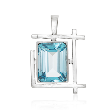 A stunning Art Deco Pendant in various gemstones by Gallardo & Blaine Designs featuring a rectangular blue gemstone set in a geometric sterling silver frame. The frame consists of intersecting straight lines, creating a modern and artistic design. The faceted gemstone catches the light beautifully, highlighting its vibrant blue color.