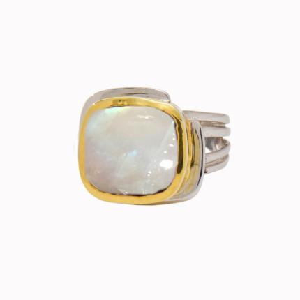 A stunning piece from Gallardo & Blaine Designs, the Art Deco Ring in Silver Gold & various gemstones boasts a large, square-cut iridescent gemstone set in a gold vermeil bezel. The sterling silver triple band design stands out beautifully against the plain white background.