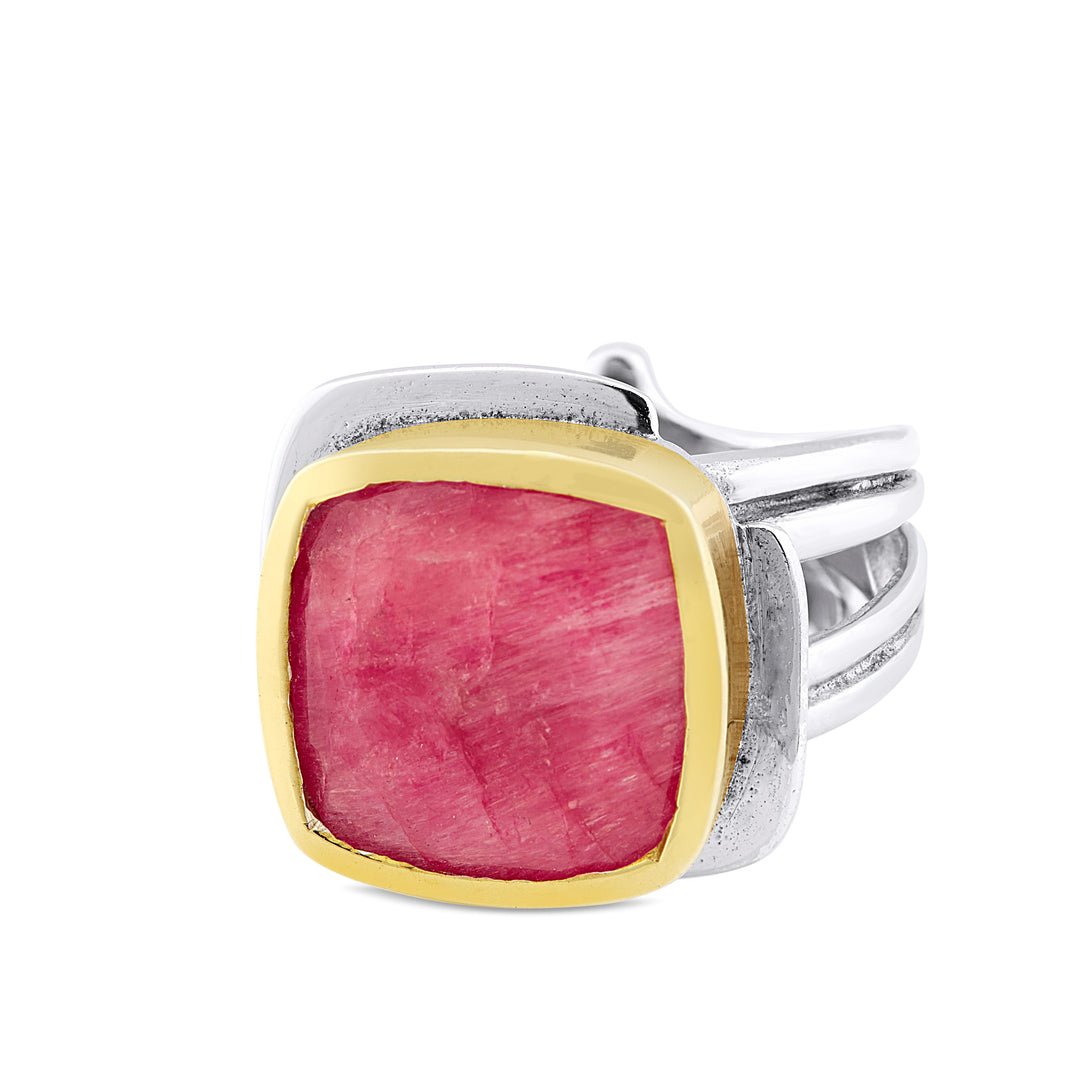 A sterling silver Gallardo & Blaine Designs Art Deco Ring in Silver Gold & various gemstones featuring a large, square-cut pink gemstone bordered with a gold vermeil bezel setting. The band of this Art Deco ring consists of multiple intertwined silver strands, creating an elegant and contemporary design.