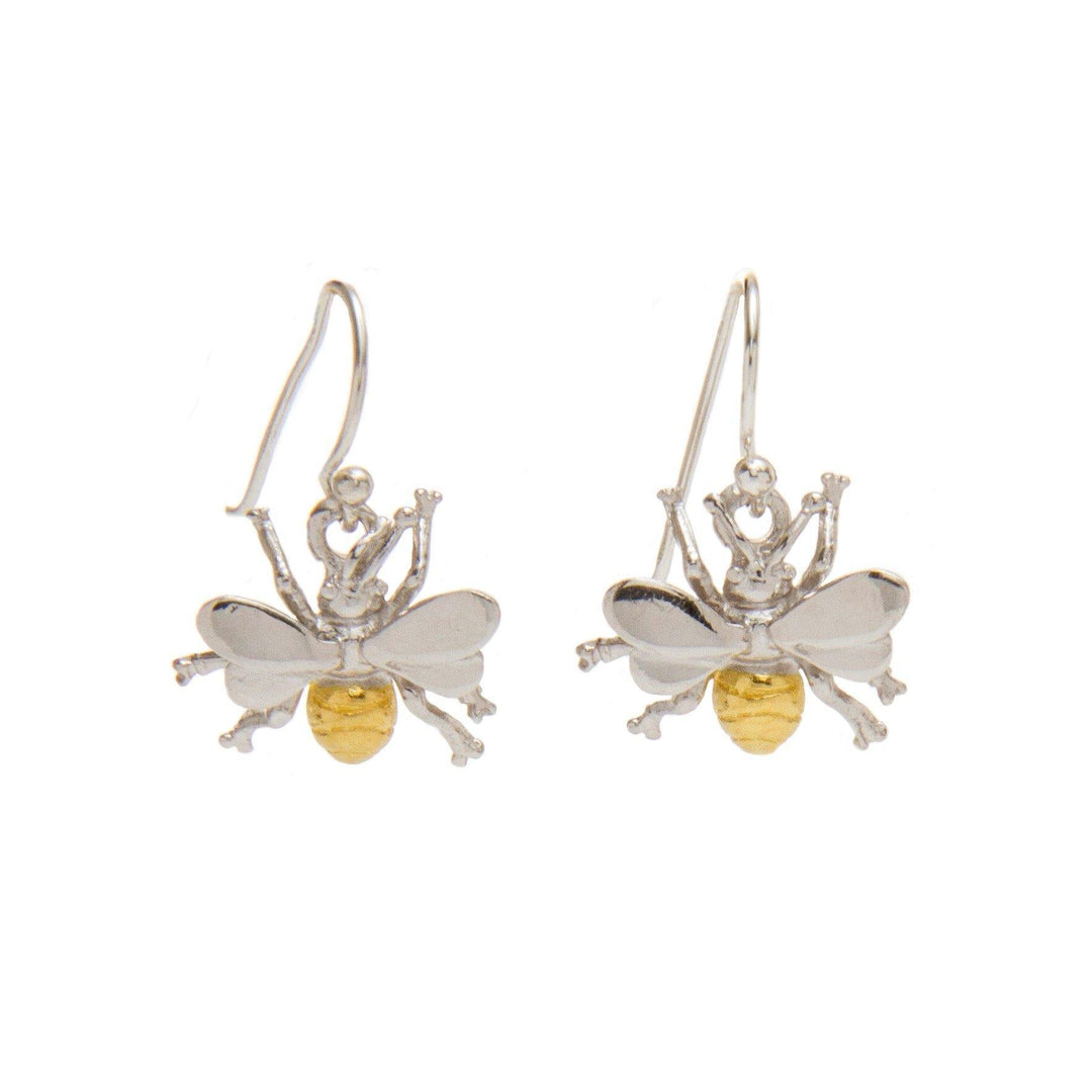 A pair of Wildlife Bee Dangle Earrings by Gallardo & Blaine Designs designed to look like bees. These pollinators accessories feature silver wings and bodies, with the bottom part of the body in gold. Each earring has a simple hook for attaching to the ear, perfect for any wildlife-themed jewelry collection.