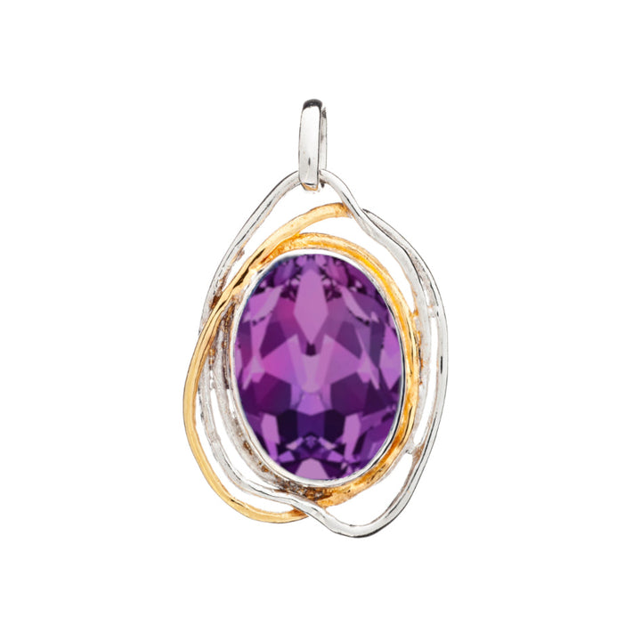 An elegant statement gemstone pendant, the Cosmos Pendant Large in various gemstones by Gallardo & Blaine Designs, features a large, faceted purple gemstone encased in an asymmetrical silver and gold dual-tone frame. The design includes intertwined metallic loops that create a modern, sophisticated look reminiscent of medieval design. The bail at the top allows it to be attached to a chain.