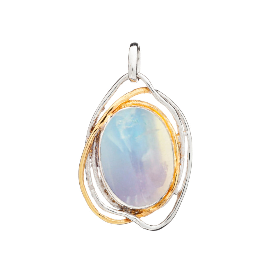 The Cosmos Pendant Large in various gemstones from Gallardo & Blaine Designs features an oval-shaped, iridescent gemstone encased in a two-toned, abstract metal frame. The medieval design intertwines silver and gold tones around the statement gemstone. A loop at the top allows for easy attachment to a chain.