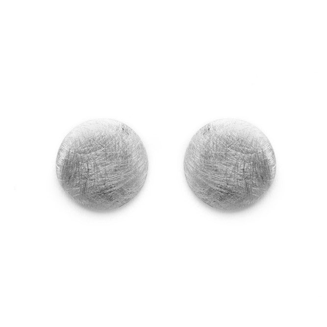 A pair of Deco Round Studs in brushed sterling silver by Gallardo & Blaine Designs, featuring a slightly textured surface against a white background. The minimalist, modern design enhances their timeless appeal.