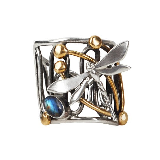 The Gallardo & Blaine Designs Dragonfly Ring features a square-shaped sterling silver band with gold accents, an intricate openwork pattern with spherical details, and a captivating blue gemstone on one side.