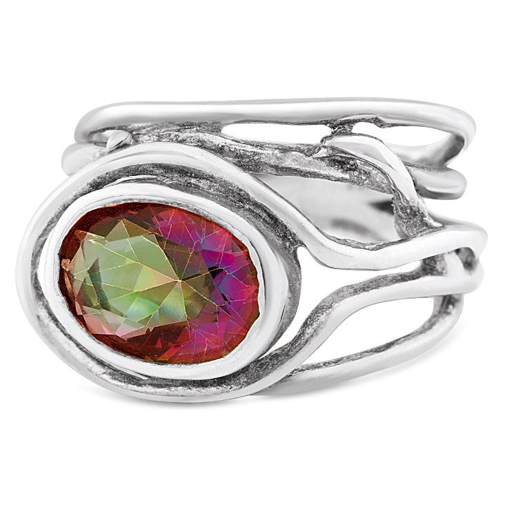 A Gallardo & Blaine Designs Fossil Ring in silver & various gemstones features an abstract, flowing design. Its centerpiece is a large, multicolored gemstone with hues of red and green, set in an oval setting. The band splits into two thin, wavy sections, creating a unique and artistic look that doubles as an adjustable ring.