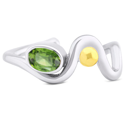 A stunning sterling silver wave-shaped ring featuring an oval green gemstone and a round gold accent. This Adjustable Heartbeat Ring by Gallardo & Blaine Designs places the green gemstone at one end of the wave, while the gold accent graces the center of its curving design, making it a unique gemstone ring.