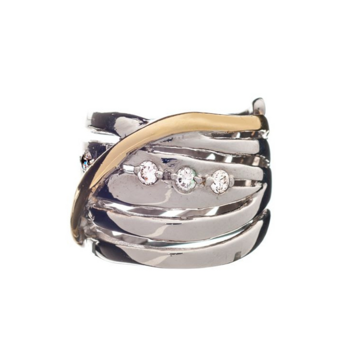 The Adjustable Hidden Gems Ring by Gallardo & Blaine Designs features a sterling silver design with layered bands and three central round diamonds. A single gold band curves diagonally, adding contrast and bold elegance to this chunky statement piece.