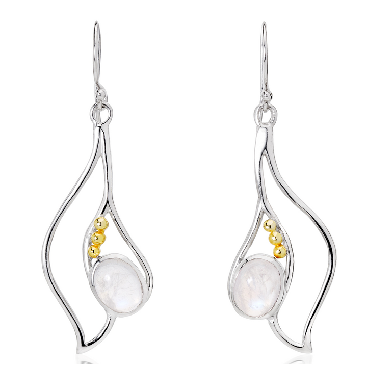 Introducing the Iris Earrings in various gemstones by Gallardo & Blaine Designs: A pair of elegant silver & gold gemstone earrings featuring an abstract, wavy design. Each earring showcases a central pearly white stone adorned with three small gold beads running alongside it. The earrings have a hook fastening for graceful wear.
