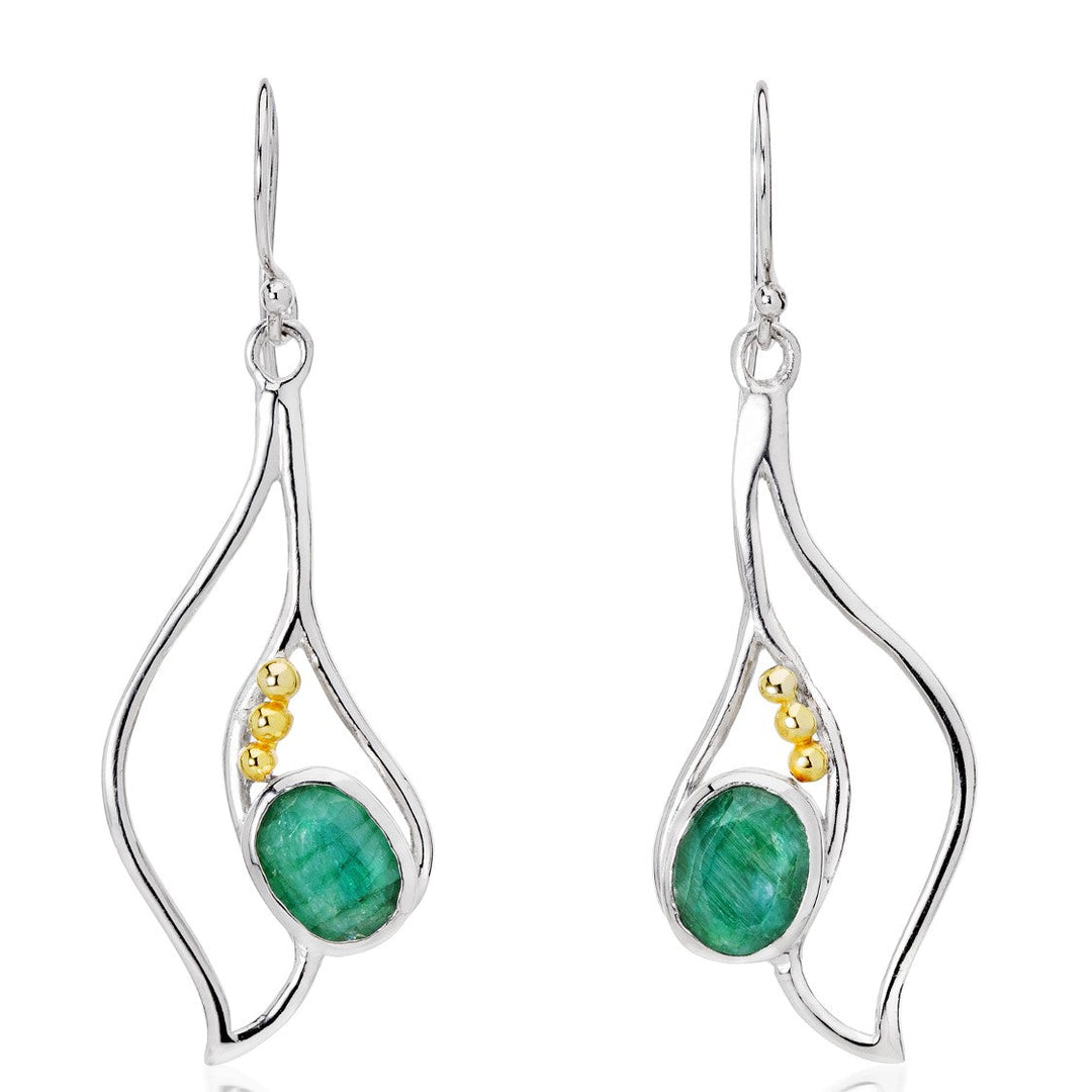 This image showcases the Iris Earrings in various gemstones by Gallardo & Blaine Designs, a pair of elegant gemstone earrings featuring a swirling silver design with green oval gemstones and small gold-colored beads. The earrings have hooked tops for wearing.