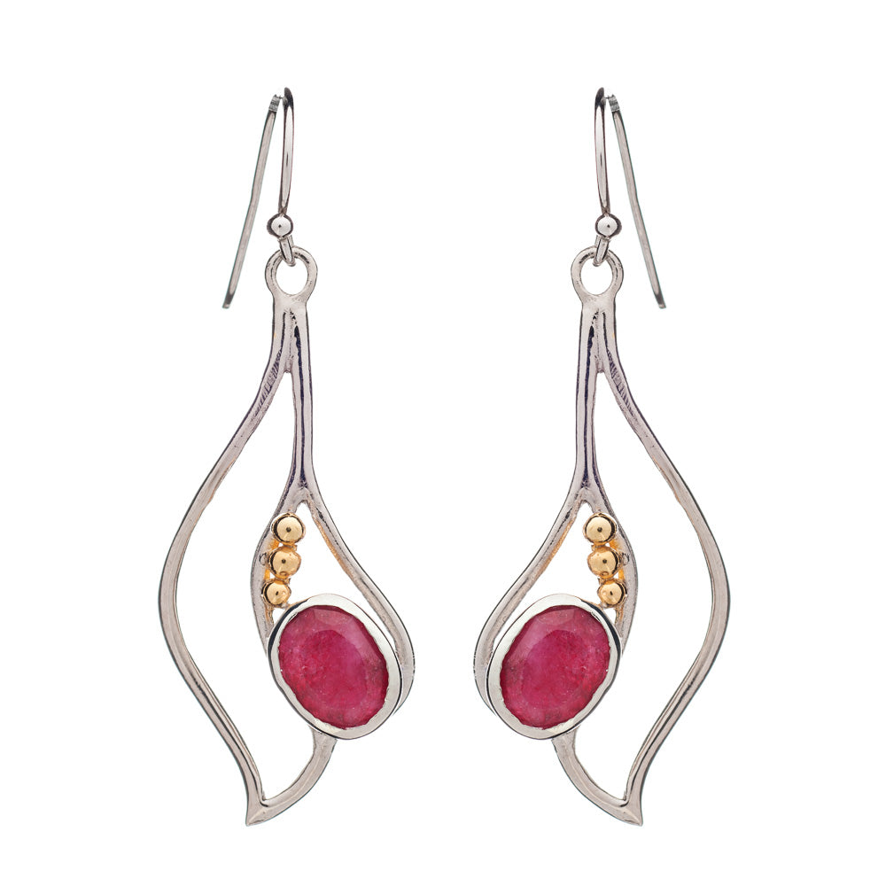 Introducing the Iris Earrings in various gemstones by Gallardo & Blaine Designs: elegant dangle earrings showcasing silver frames with fluid, wavy designs. Each earring is adorned with a pink oval gemstone and three small gold-colored beads. These exquisite gemstone earrings feature fish hook backings for easy wear.