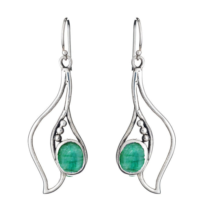 Introducing the Iris Earrings in various gemstones by Gallardo & Blaine Designs: a pair of silver and gold dangly earrings featuring an intricate, organic design. Each earring showcases three small silver beads and a vibrant green oval gemstone set in the center. The hook-style clasps ensure comfortable wear, making these gemstone earrings truly captivating.