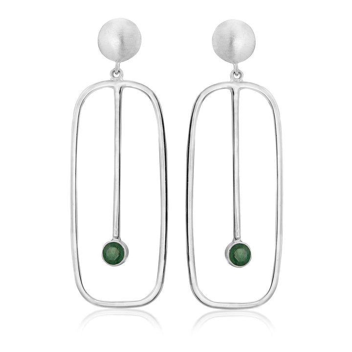 The Lorelei Earrings Large in various gemstones by Gallardo & Blaine Designs are a pair of elegant drop earrings featuring a matte-finish silver circular top, followed by an elongated open oval frame. Inside the frame, a vertical silver rod ends in a small round green gemstone, creating a minimalist and contemporary design.