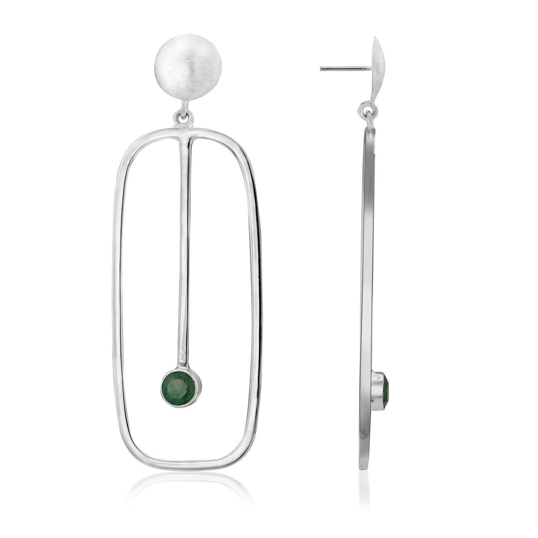 Introducing the Lorelei Earrings Large in various gemstones by Gallardo & Blaine Designs: a pair of modern silver drop earrings. Each features a matte circular stud, from which dangles an elongated, rectangular open frame. A green gemstone is set at the bottom of a thin vertical bar that extends down the middle of the frame.