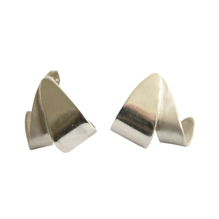 Origata Studs by Gallardo & Blaine Designs: modern, abstract sterling silver earrings with smooth, curved surfaces and angular folds, displayed against a white background.