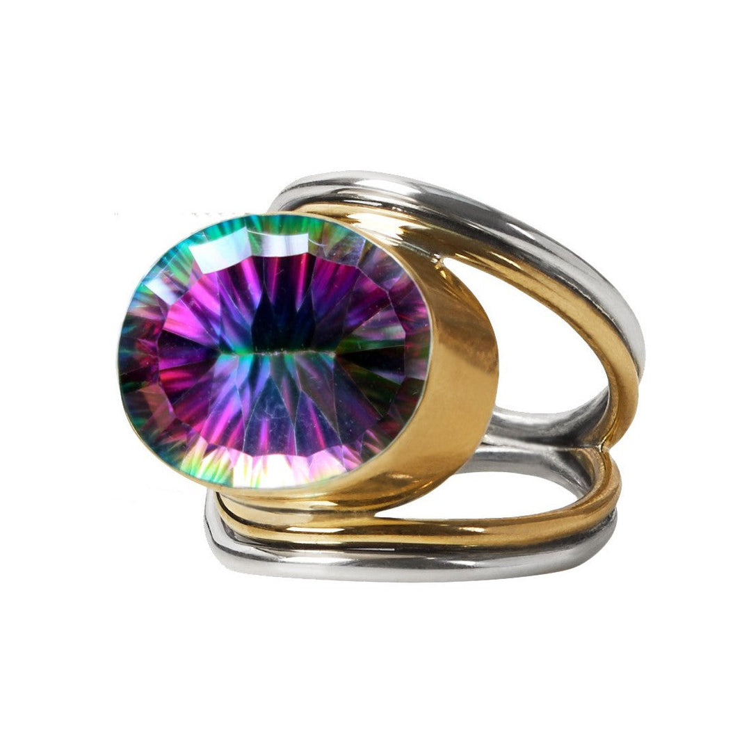 A Party Ring in various gemstones set in a sterling silver and gold dual-band ring. The statement gemstone displays a vibrant array of colors, including purple, green, and blue, cut to reflect light for a dazzling effect. With its sleek, modern design, this adjustable ring from Gallardo & Blaine Designs makes an elegant impression.