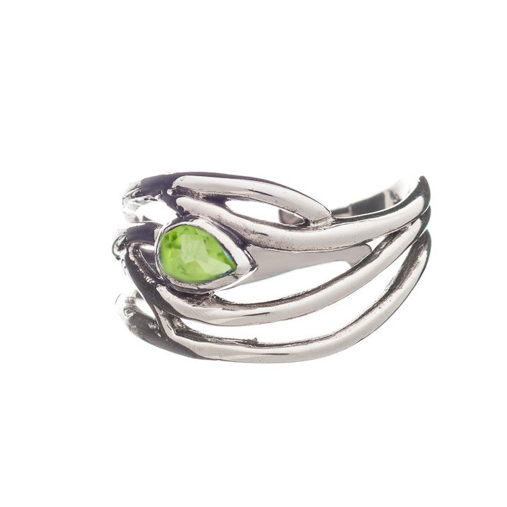 A Peacock Ring in various gemstones featuring an abstract, flowing design with a single, teardrop-shaped green gemstone set in the center. The band has intertwining loops, giving it a unique and modern appearance. This elegant dainty ring by Gallardo & Blaine Designs is available adjustable in silver & gold, and the white background highlights its details perfectly.