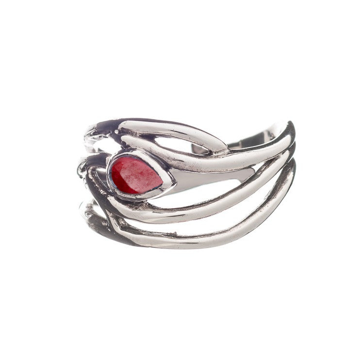 A silver Peacock Ring in various gemstones designed with intertwining, vine-like bands holding a single, teardrop-shaped red gemstone at its center. The intricate design gives this adjustable piece in silver and gold a unique and elegant appearance by Gallardo & Blaine Designs.