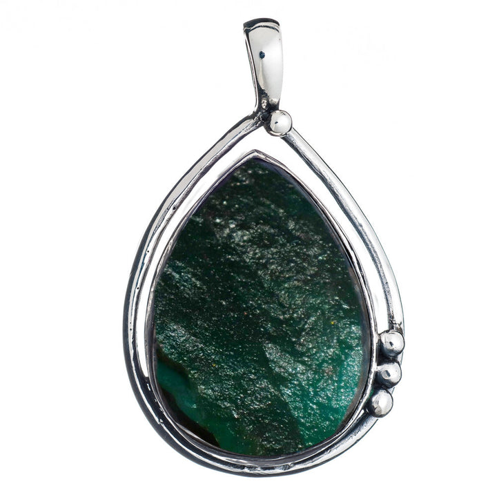 Introducing the **Poppy Pendant Large in various gemstones**: A teardrop-shaped pendant featuring a mesmerizing labradorite stone set in a sleek, sterling silver frame with three small, round silver accents along one side. The stone has a textured, slightly translucent surface that catches the light beautifully. **Gallardo & Blaine Designs** brings you this stunning piece that effortlessly combines elegance and sophistication.